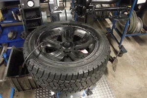 Tire being installed on wheel