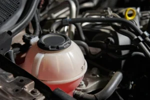 radiator tank with red fluid inside 